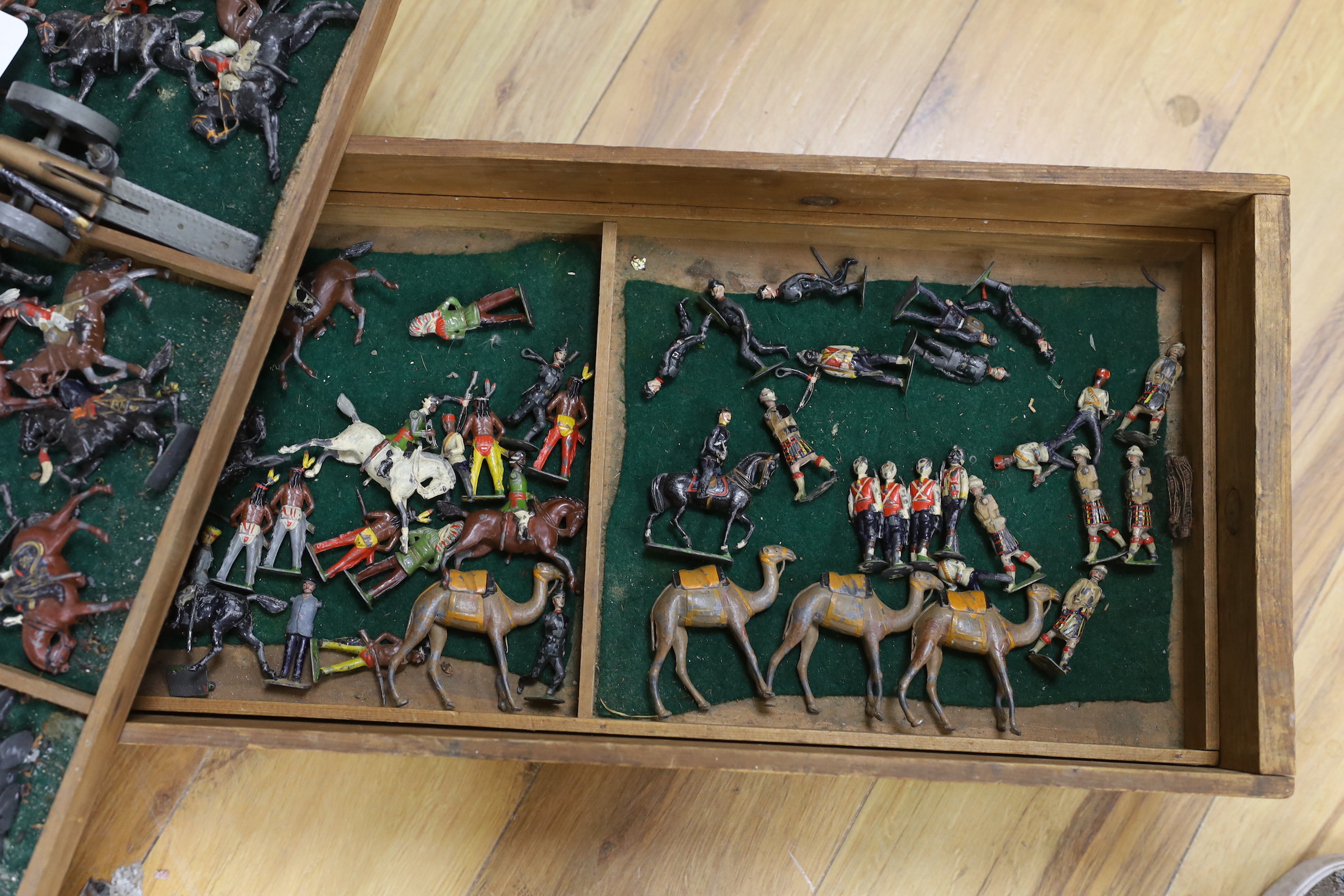 A childhood collection of Britains and other hollow-cast lead soldiers and two field guns, pre-war